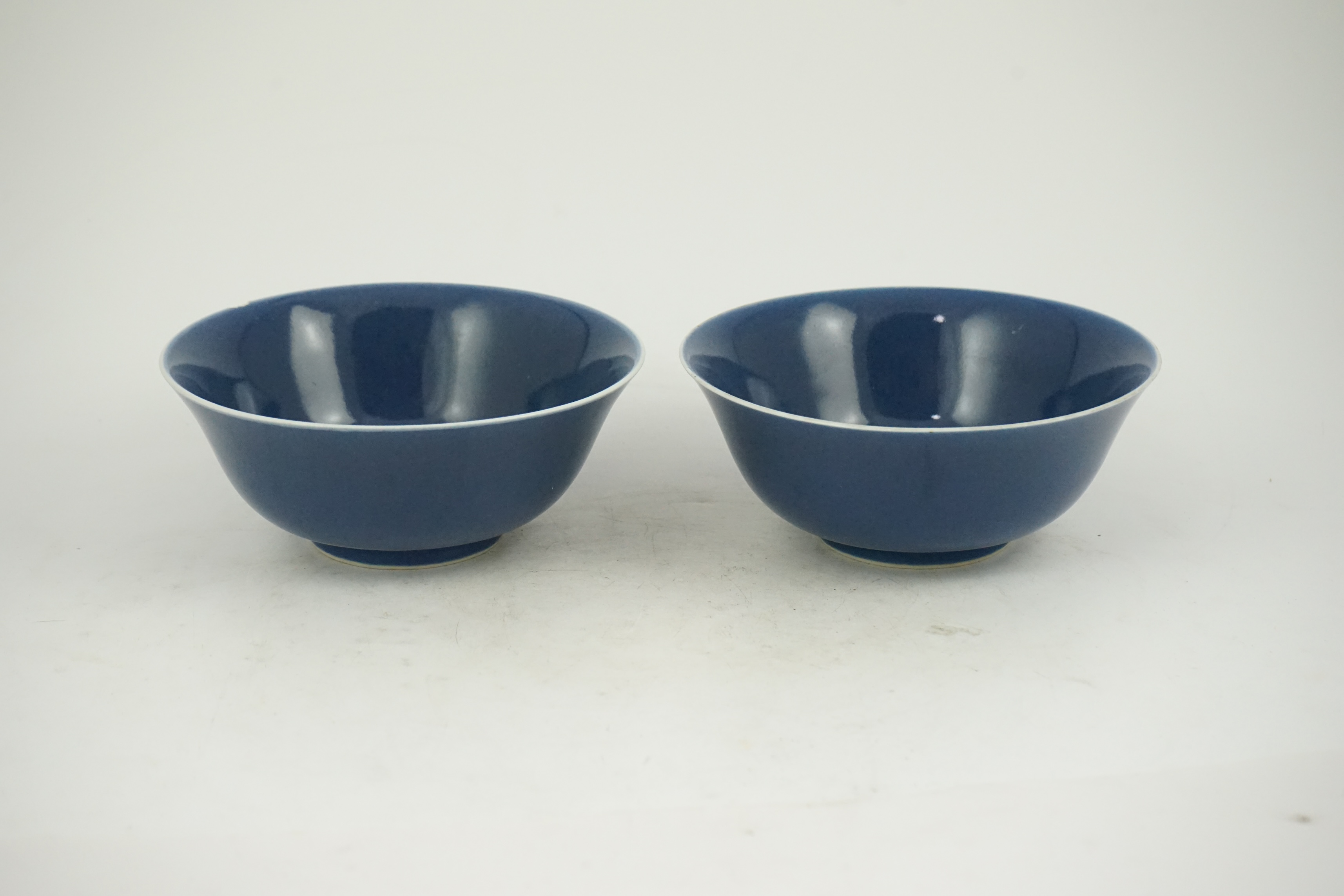 A pair of Chinese powder blue glazed bowls, Daoguang mark and of the period (1821-50)